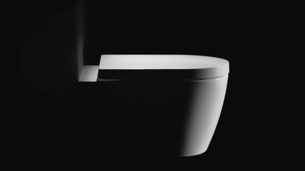 Torneira de design minimalista em ambiente escuro, representando o luxo contemporâneo em 2026 por meio de formas puras, tecnologia silenciosa e estética essencial.